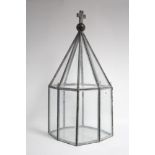 A leaded glazed terrarium of octagonal form & with crucifix finial, 13¾” wide x 30½” high.