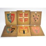 Six oak veneered rectangular panels, each with marquetry coat-of-arms of various cities, etc.