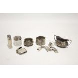 An Edwardian silver oval two-handled mustard pot with embossed scroll design, Birmingham 1903; an