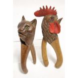 Two pairs of carved treen novelty nut-crackers in the form of a cat’s head & a chicken’s head (