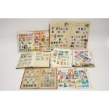 A collection of World stamps contained in four S.G. “Devon” albums; & a collection of GB &