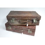 Two early 20th century tan leather suitcases, each fitted chrome twin-lever locks, 26” x 17” x