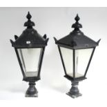 A pair of black painted cast-metal gate-post lanterns of square tapered form & inset glazed side