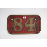 A late 19th/early 20th century red & gold painted cast-iron rectangular plaque “84”, 9¾” x 16¾”.