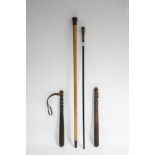 An ebony gent’s walking cane with white-metal collar, 31¾" long; together with another walking cane;