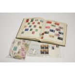 A Triumph album & contents of GB & foreign stamps; a few First ay covers; & a small quantity of