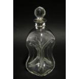 An Edwardian clear glass “Dimple” decanter with faceted ball stopper & silver neck-mount, 11½” high;