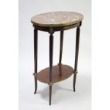 A reproduction Louis XVI oval two-tier occasional table with pink marble top