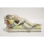 A LATE 18th Century STAFFORDSHIRE PEARLWARE FIGURE OF LUCRETIA, lying naked on a day bed, on