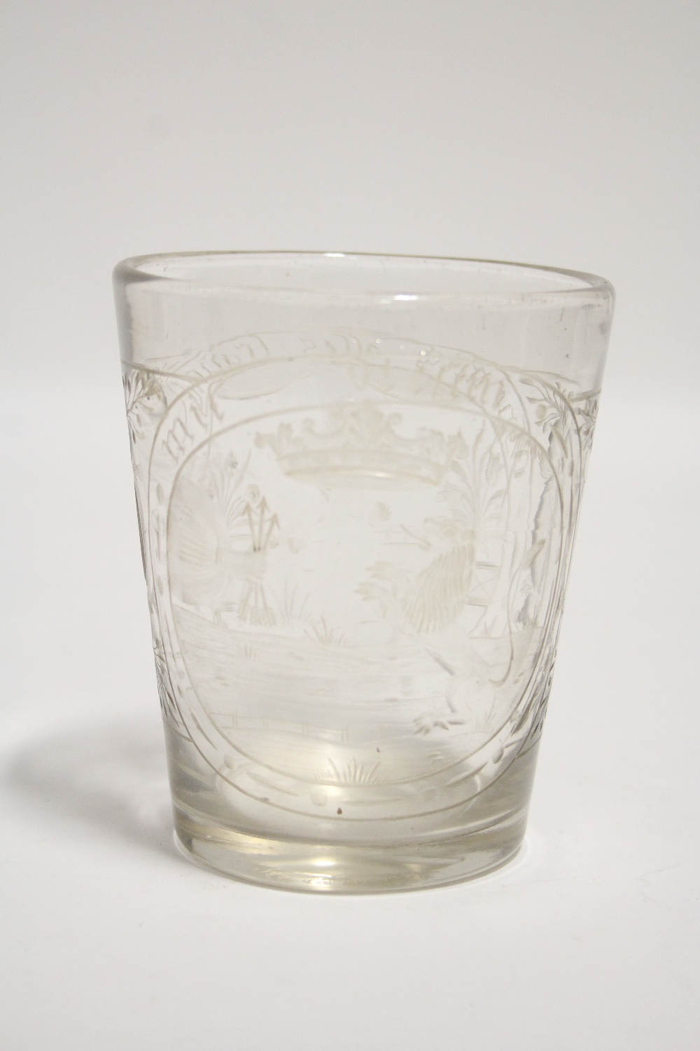 AN 18th Century GERMAN GLASS FUNNEL-SHAPED BEAKER with intaglio engraved heraldic device to one side