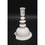 A RARE 17th Century WHITE GLAZED DELFT CANDLESTICK with baluster column on high dome-shaped circular