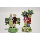 A TITTENSOR pearlware group of “Dandies”, the standing male & female figures with bocage support, on