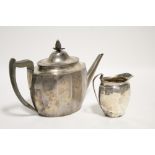 A George V oval teapot in the late 18th century style, with panelled sides, boxwood handle &