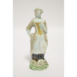 A late 18th century Ralph Wood type standing figure of a shepherdess, on mound base; 8" high. (Glaze