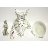 An 18th century Meissen porcelain barrel stand on three rococo-scroll legs, 8" high; a ditto