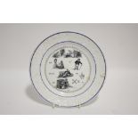 A 19th century French porcelain 8¼" plate with printed pictogram puzzle, the solution printed on the
