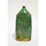 An 18th century Hungarian green glazed pottery flask with narrow neck & incised simple leaf