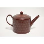 An 18th century Staffordshire Redware large cylindrical teapot with engine-turned decoration; 6¼"
