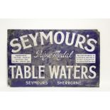 An enamel advertising sign for “SEYMOUR’S Prize Medal TABLE WATERS”, with white lettering on a