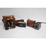 A pair of Pathescope 10 x 50mm binoculars; & two Kodak cameras, each with case.