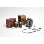 A Voigtlander “Brillant” box camera; & a pair of field glasses, each with leather case.