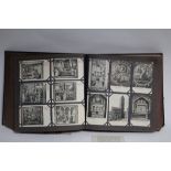 AN ALBUM OF APPROXIMATELY SIX HUNDRED POSTCARDS, EARLY 20th century, RELIGIOUS FIGURES AND