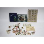 Various mixed cigarette & tea cards in one album & loose; together with a Shell “Historic Cars” coin