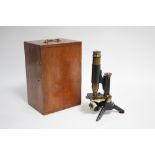 A Jas Parker & Son of Birmingham black lacquered & brass monocular telescope, 10½” high, with