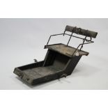 A black painted wooden pony trap seat with iron fittings, 42” long.