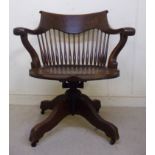 An early 20thC oak framed desk chair, ha