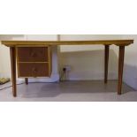 A 1960s/1970s teak finished desk, design