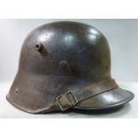 A Great War German steel helmet with a c