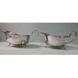 A pair of silver sauce boats, having fla