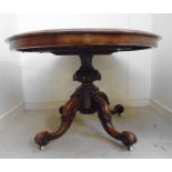 A late Victorian walnut breakfast table,