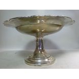 A silver tazza, having a broad, shaped,