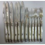 A set of six silver dessert knives and f