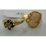 Two gold coloured metal rings, one claw