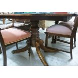 A Victorian and later mahogany dining ta