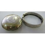 A silver bracelet, having foliate orname