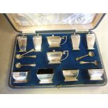 An Art Deco ten piece silver condiments