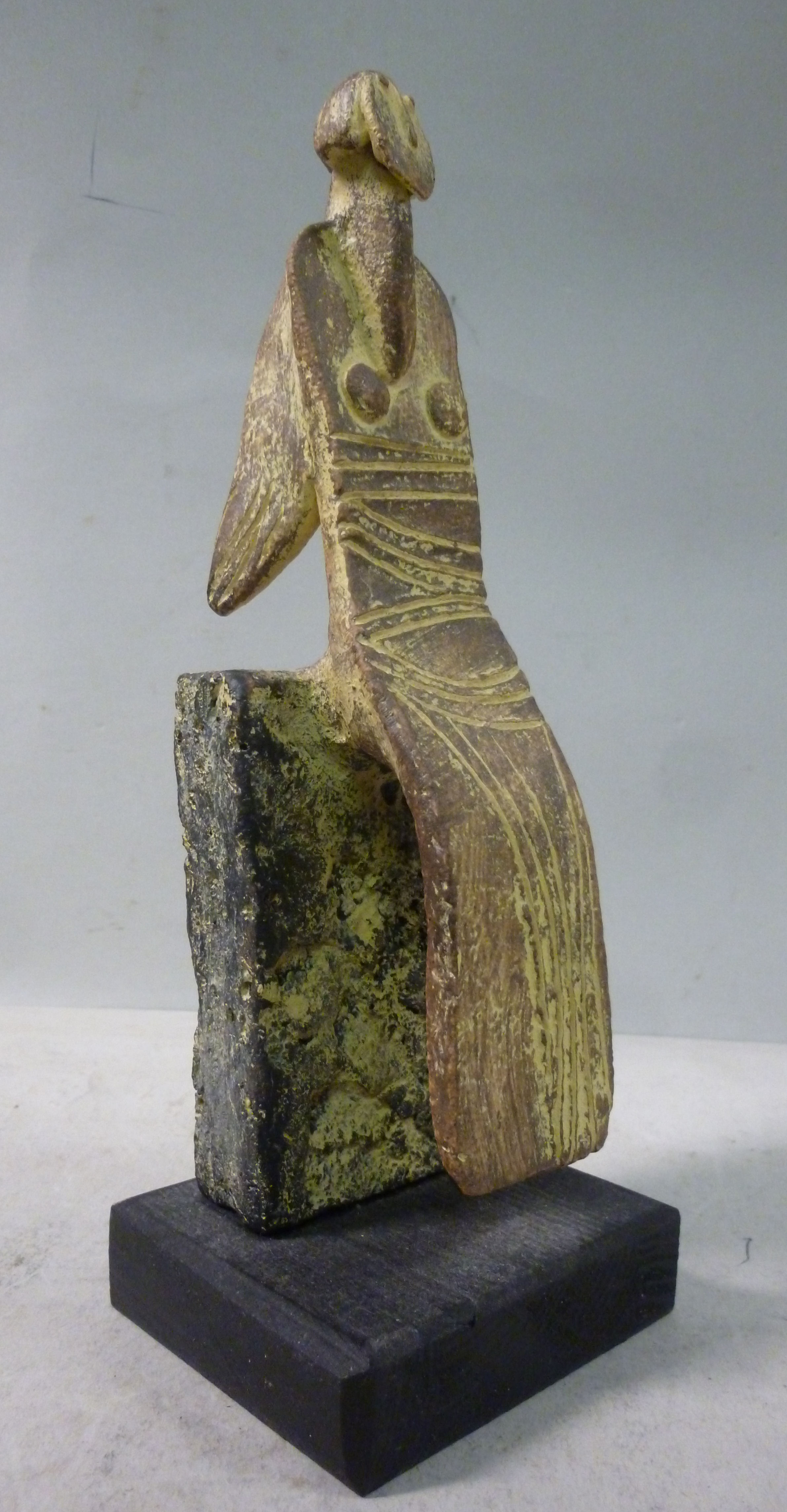 A John Maltby pottery figure, a seated a