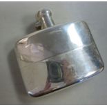 A silver hip flask of curved, cushion fo