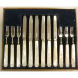 A set of six silver dessert knives and f