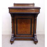 A late Victorian figured walnut and ebon