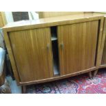 A 1960s teak finished bow front record c