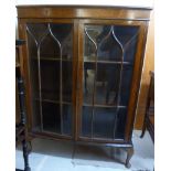 A 1930s oak bow front display cabinet, h