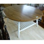 An Ercol elm coffee table, the oval top