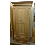 A modern waxed pine wardrobe, having a s