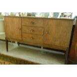 A late 1950s teak finished sideboard, th