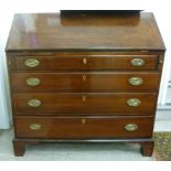 An early 19thC mahogany bureau, the fall